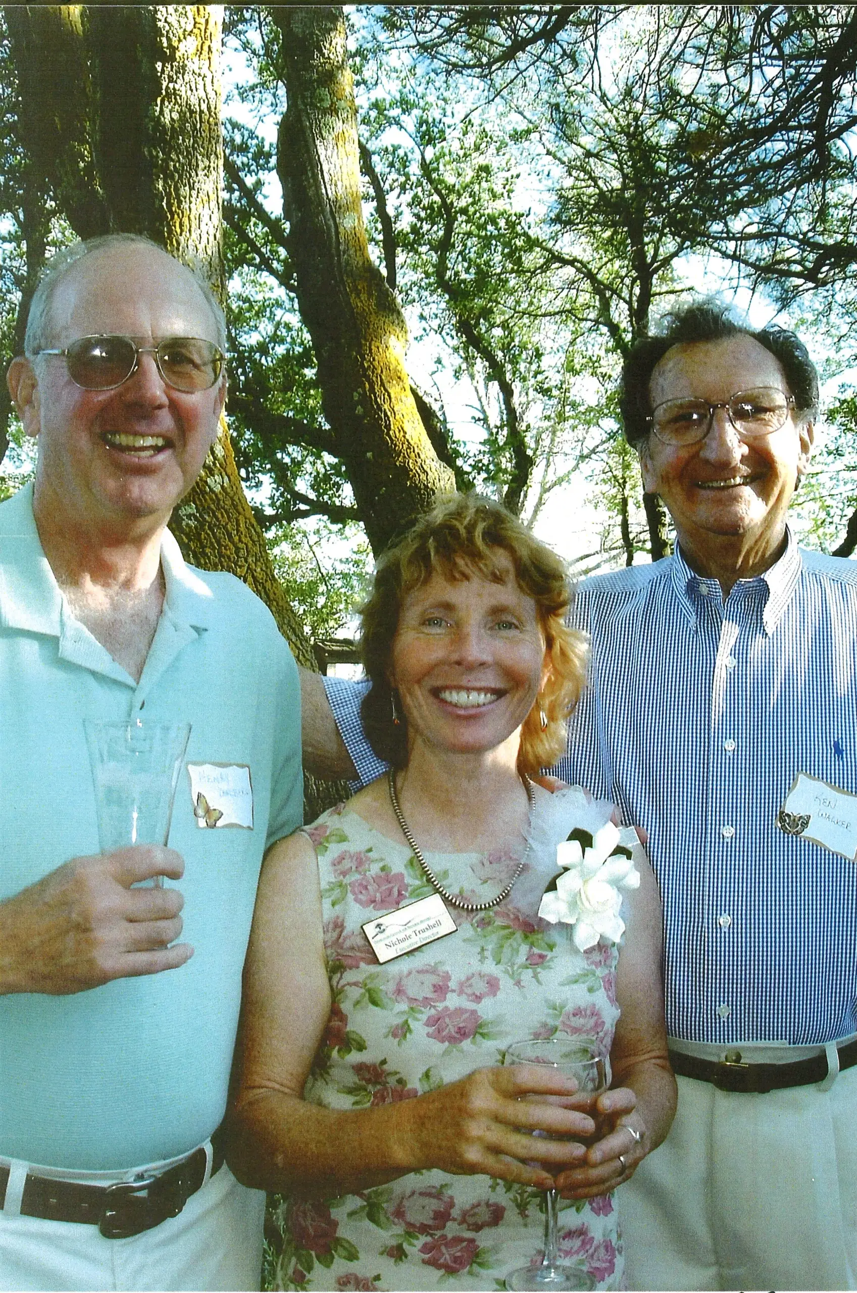 Self-serve tap wall at City Tavern with digital beer menus and wooden-handled taps