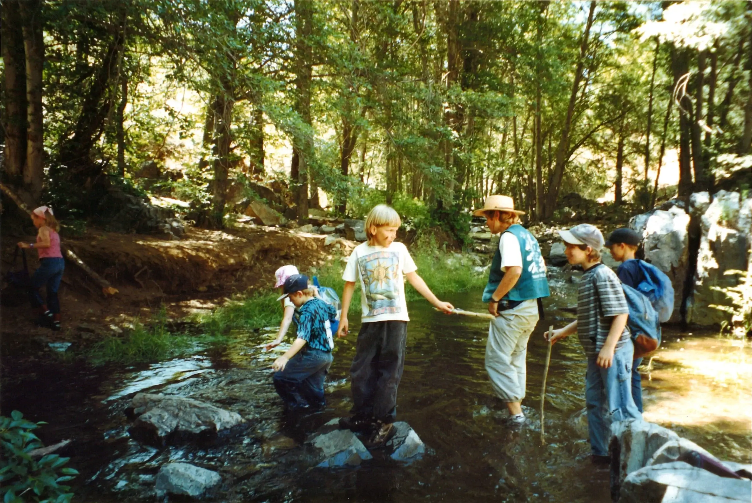 Self-serve tap wall at City Tavern with digital beer menus and wooden-handled taps
